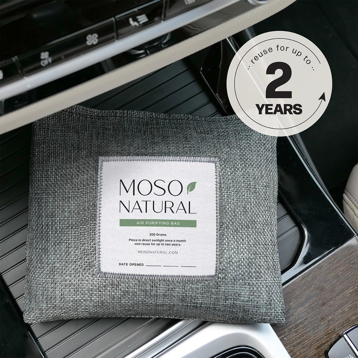 Moso Natural held in hand for size comparison and portable odor removal
