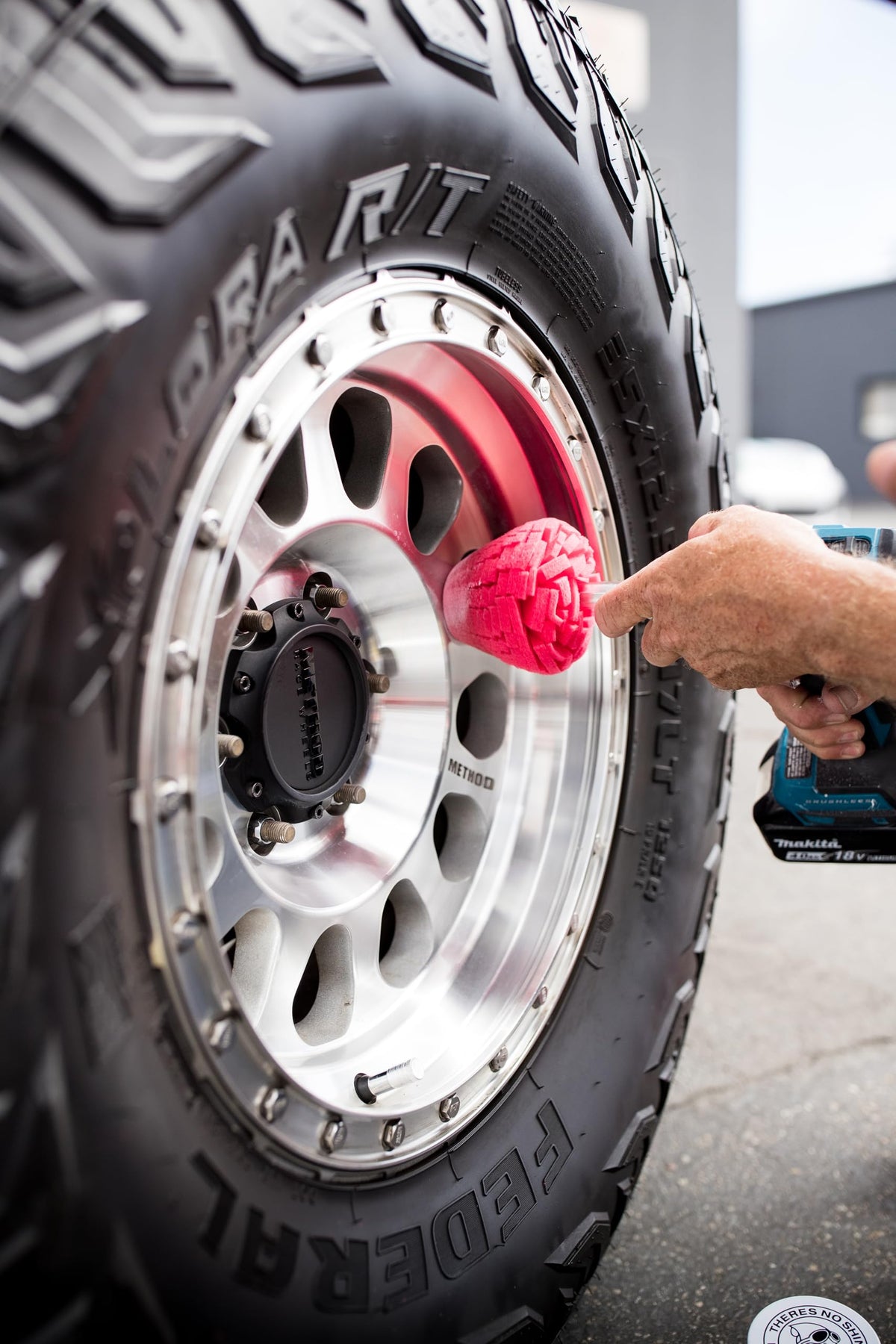 Garage scene with Mothers PowerCone 360 in use, illustrating practical detailing workflow