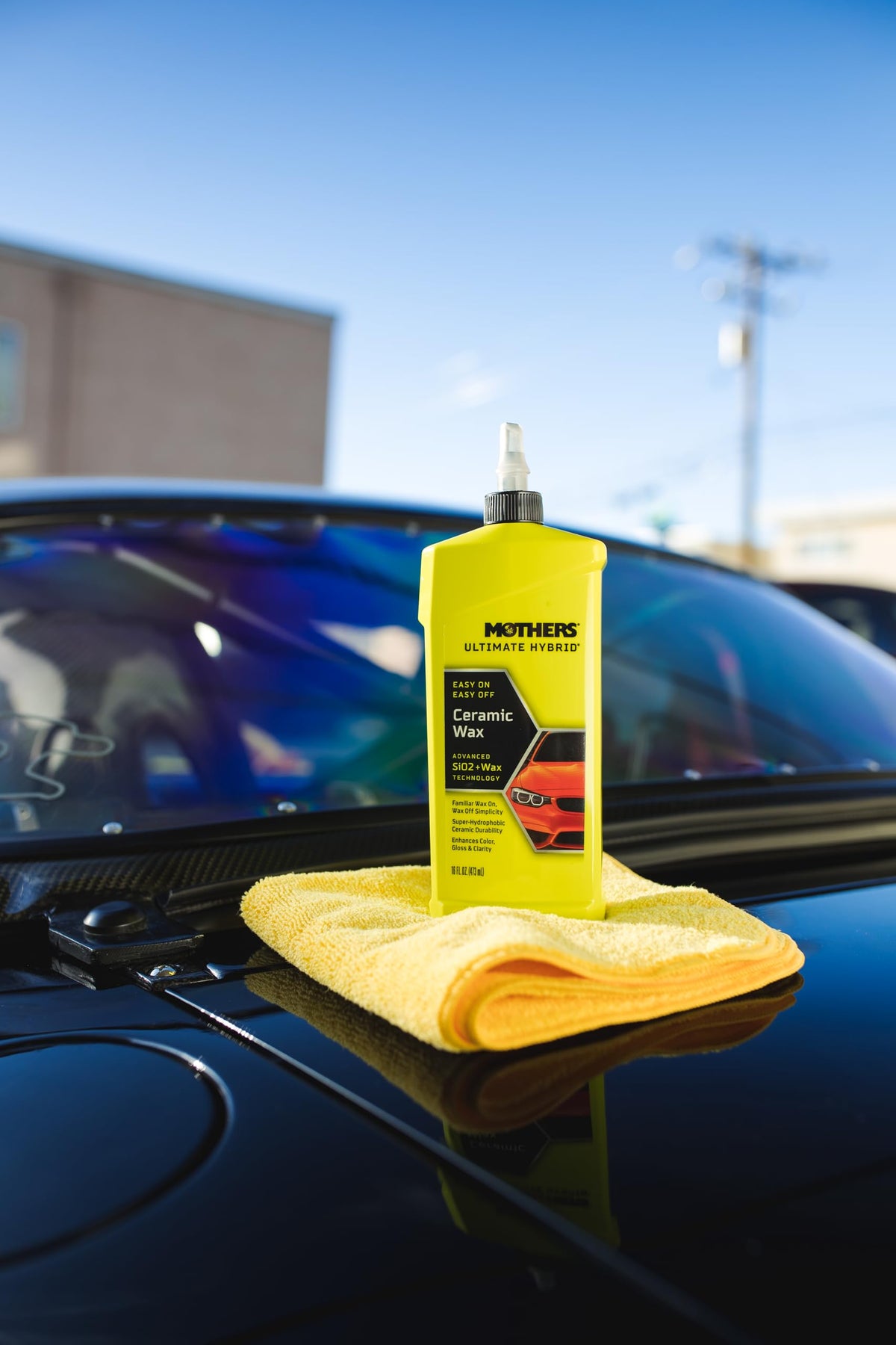 Mothers applying wax on car panel demonstrating easy wax-on wax-off application