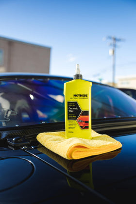 Mothers applying wax on car panel demonstrating easy wax-on wax-off application