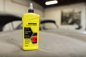 Mothers product staged with towels and applicator for a complete detailing setup