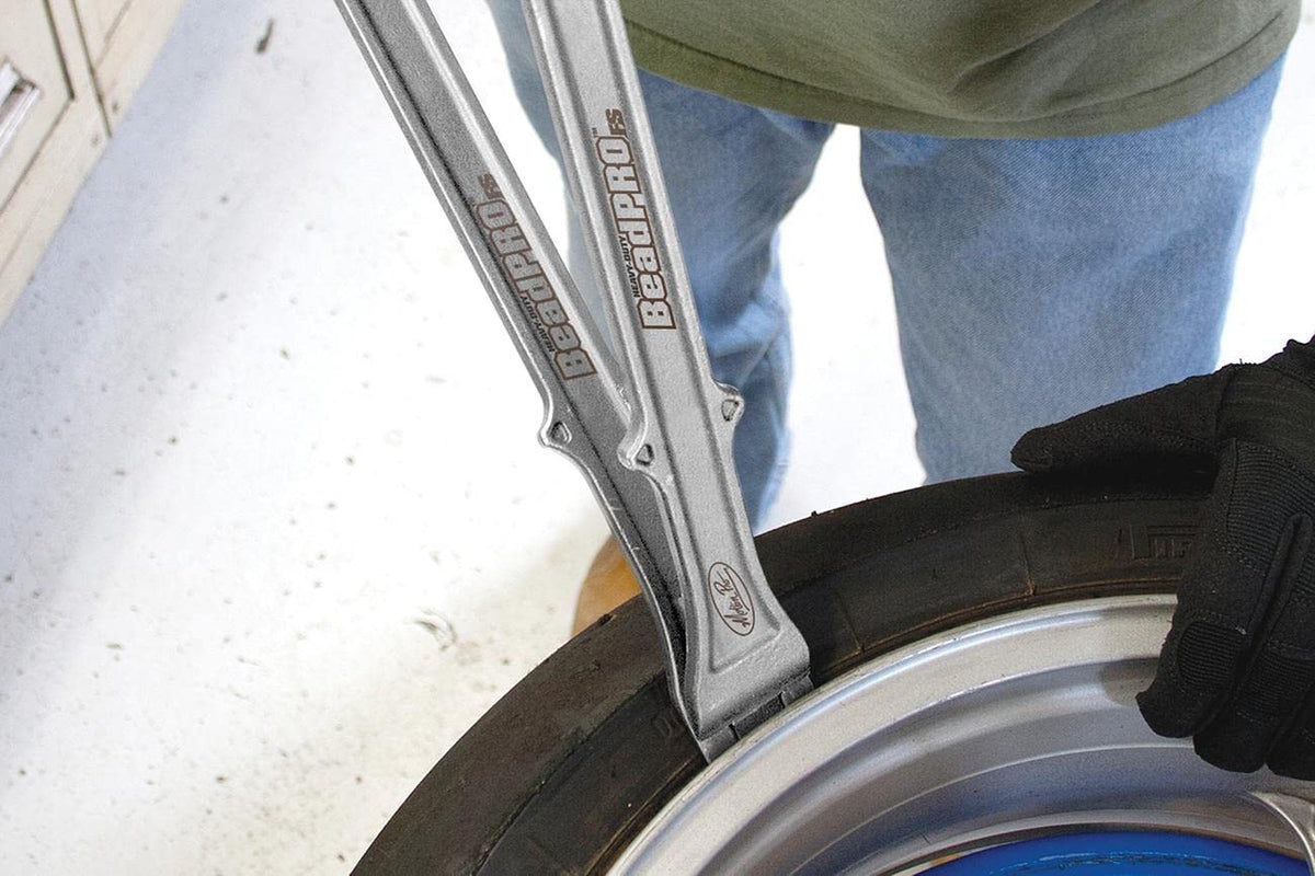 Motion Pro close-up of forged steel head highlighting strength and wear resistance