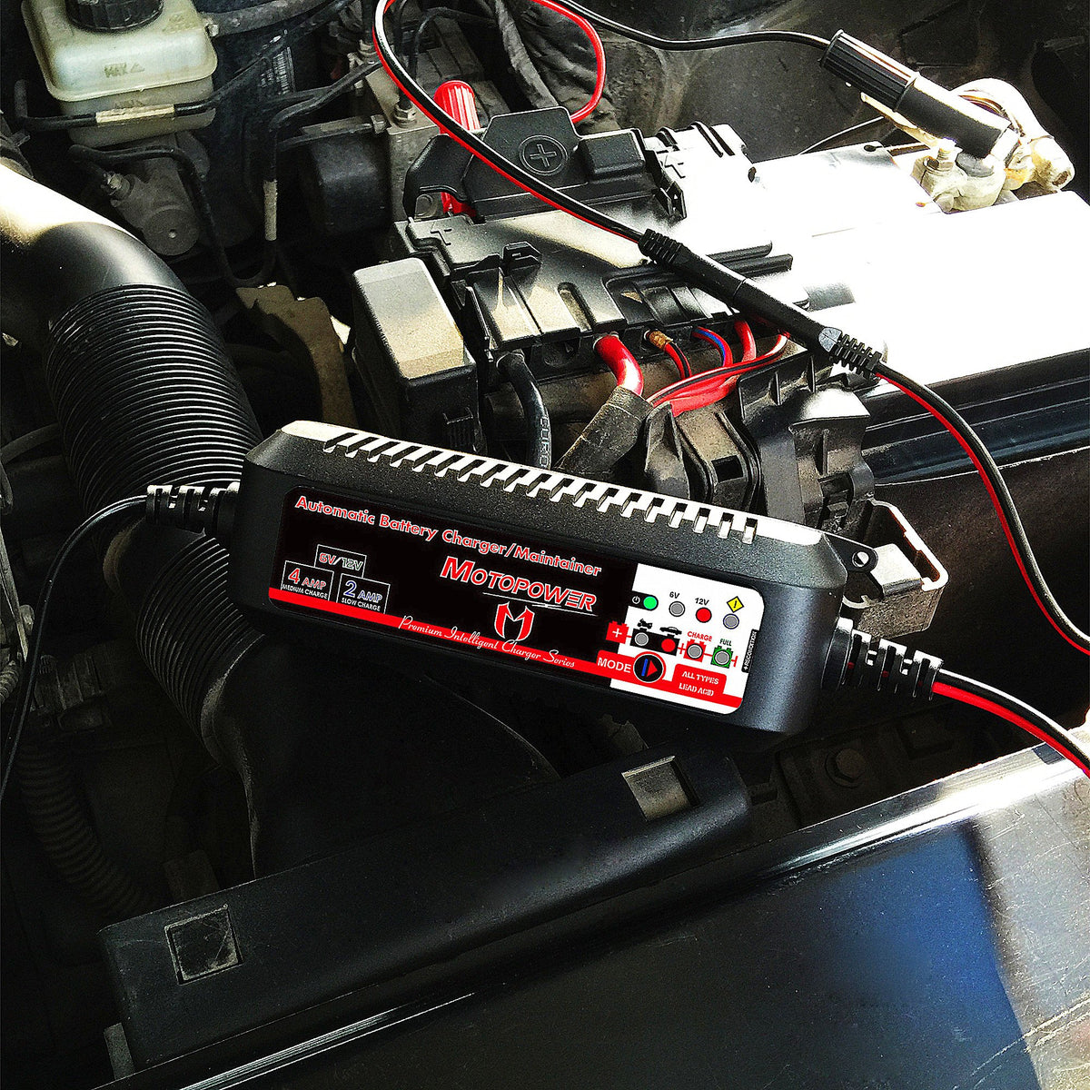 MOTOPOWER beside a hand to show compact size and storage convenience