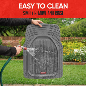 Motor Trend mat being hosed clean outdoors showing easy maintenance benefit