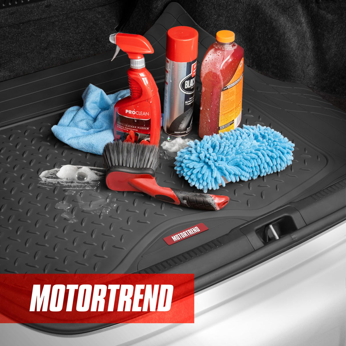 Motor Trend liner installed in compact trunk keeping cargo clean