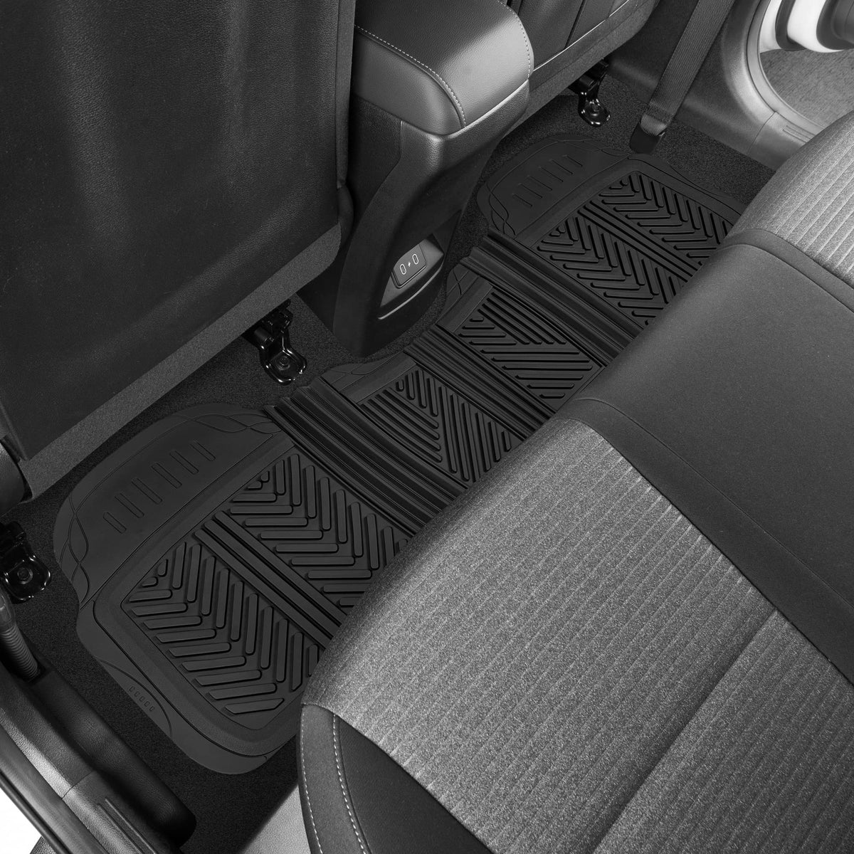 Motor Trend mat under muddy boots demonstrating heavy-duty cleanup