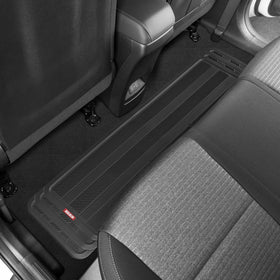 Motor Trend runner beside tape measure demonstrating trimmable size
