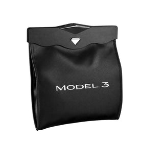 Motrobe front view clipped to Model 3 seatback shows tidy disposal benefit