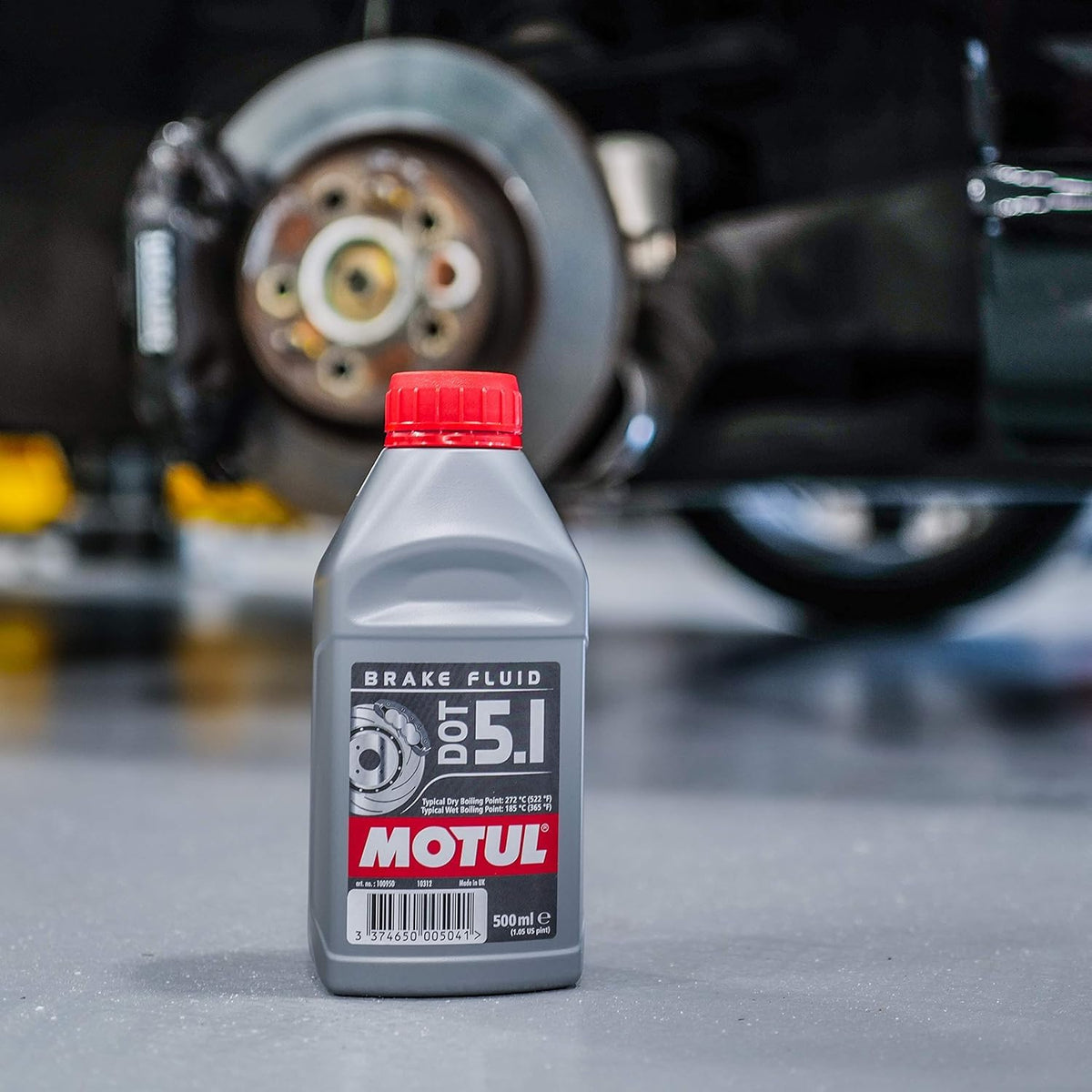 Motul DOT 5.1 pouring into brake reservoir demonstrating clean serviceability