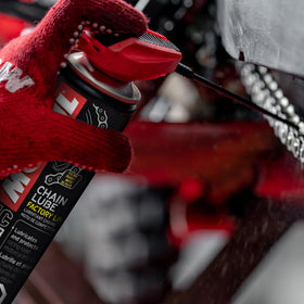 Motul can in a garage with a sportbike showing professional maintenance use