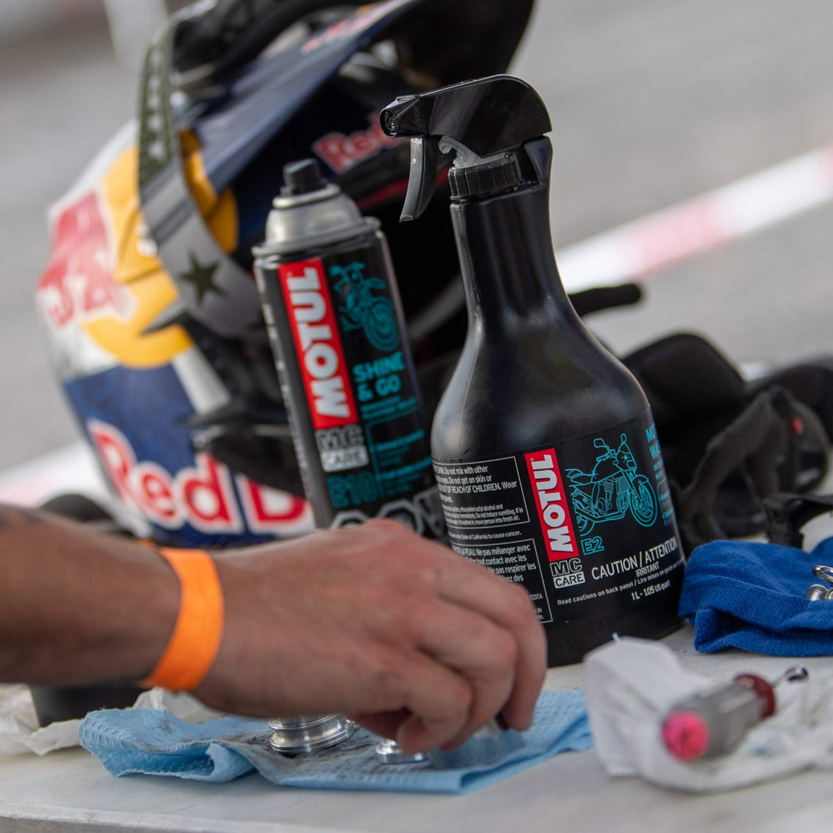 Motul MC Care E2 1L bottle size comparison showing convenient volume