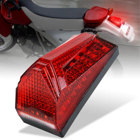 MOVOTOR tail light front view showing red lens and integrated plate lamp benefit visibility