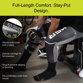 MSR Moto socks worn inside motocross boot demonstrating secure fit