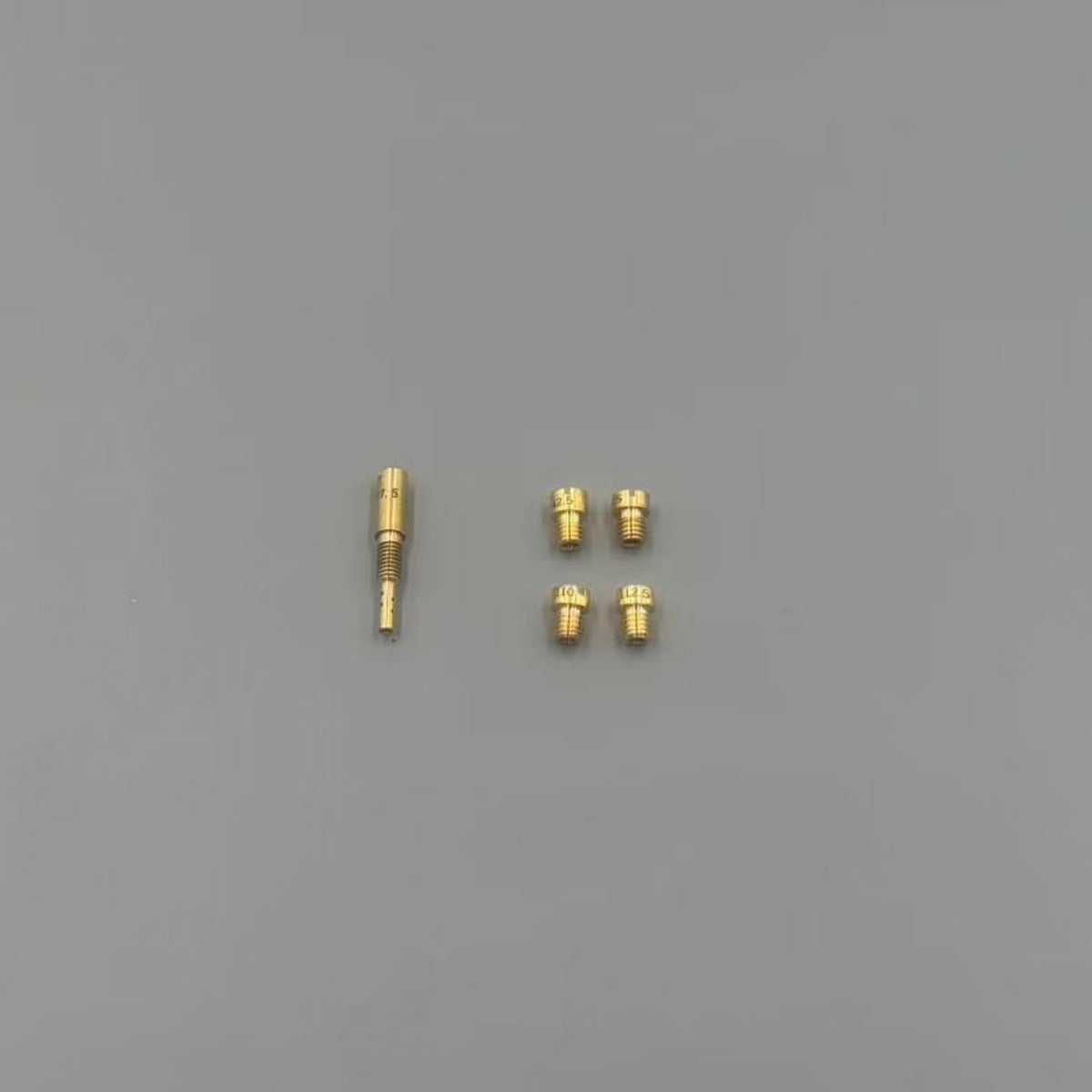MTCCARB parts laid out next to a ruler showing scale and included components