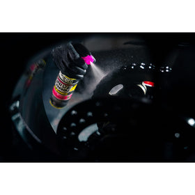 Muc-Off poured into chain-cleaner tool for efficient machine cleaning