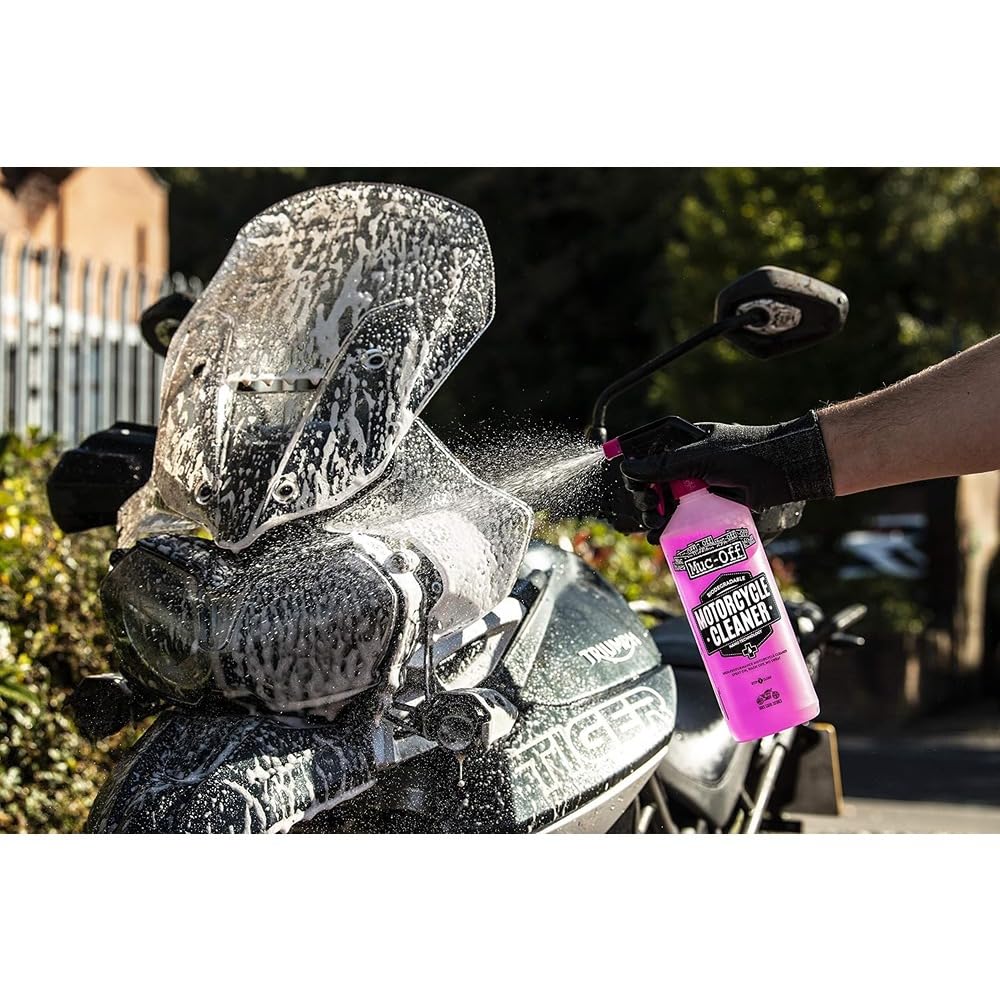 Muc-Off cleaner in use on motorcycle to remove grime effectively