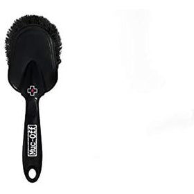 Muc-Off assortment of brushes and sponge laid out for efficient cleaning