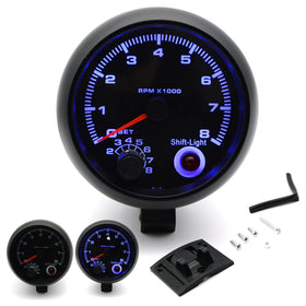 Mulcort tachometer mounted in car dash demonstrating compact fit and night visibility