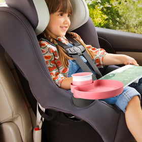 Munchkin Miracle 360 cup in cupholder demonstrates secure spill reduction benefit