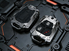 Muxkenper key fob in hand showing size, ergonomic grip, and premium aesthetic