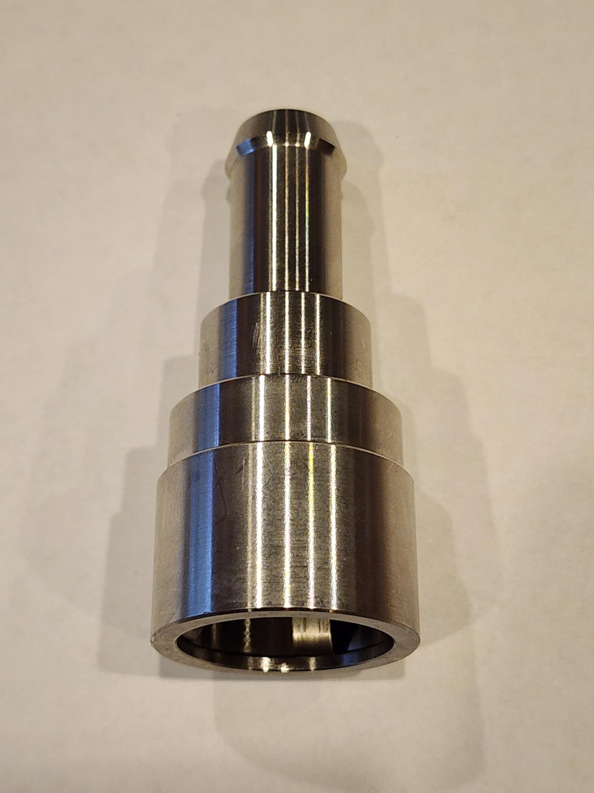 Muzzys assembled clamp on connector demonstrating secure hose hold