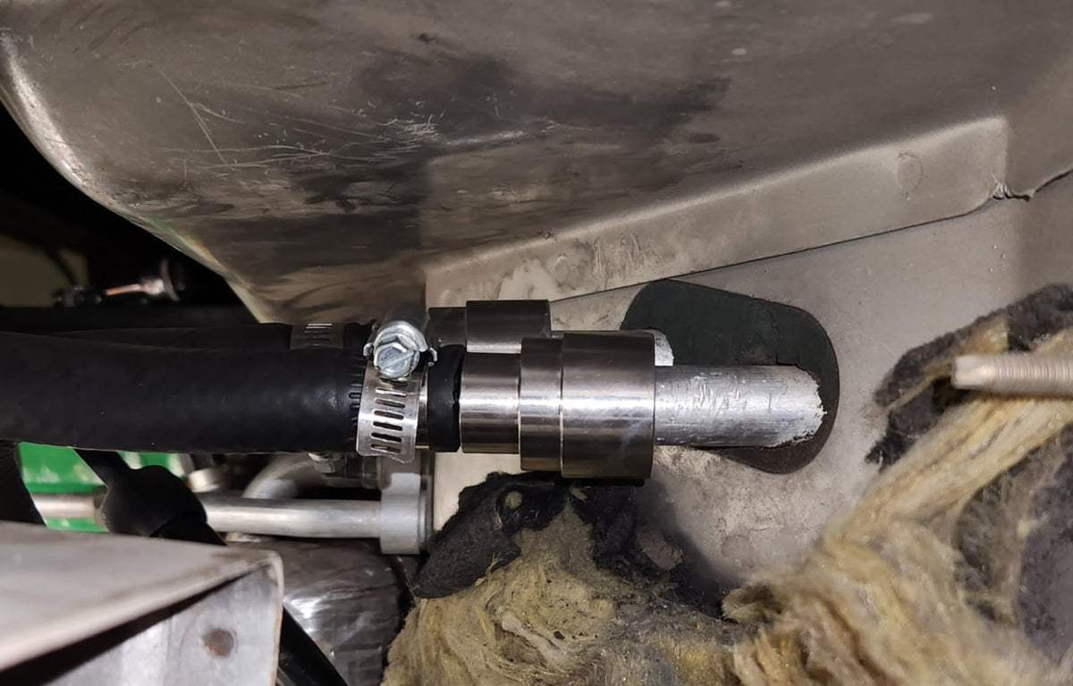 Muzzys connector installed at firewall showing leak-free coolant routing