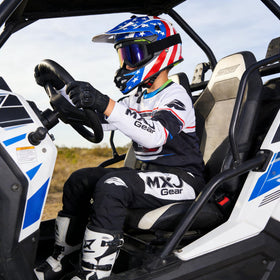 MXJ Gear helmet lifestyle riding on dirt bike demonstrating real-world use