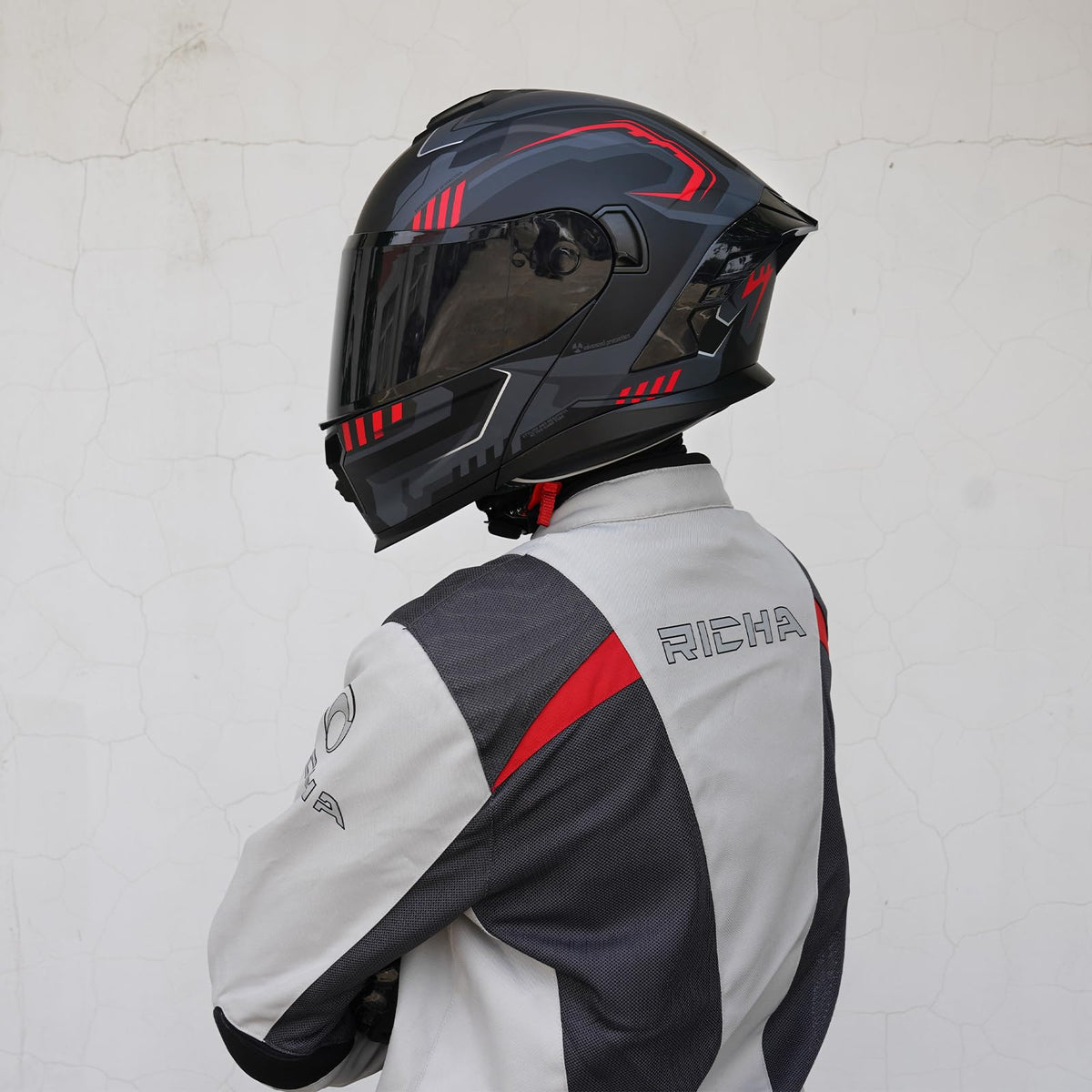 MXJ Gear helmet next to ruler for size comparison and fit benefit