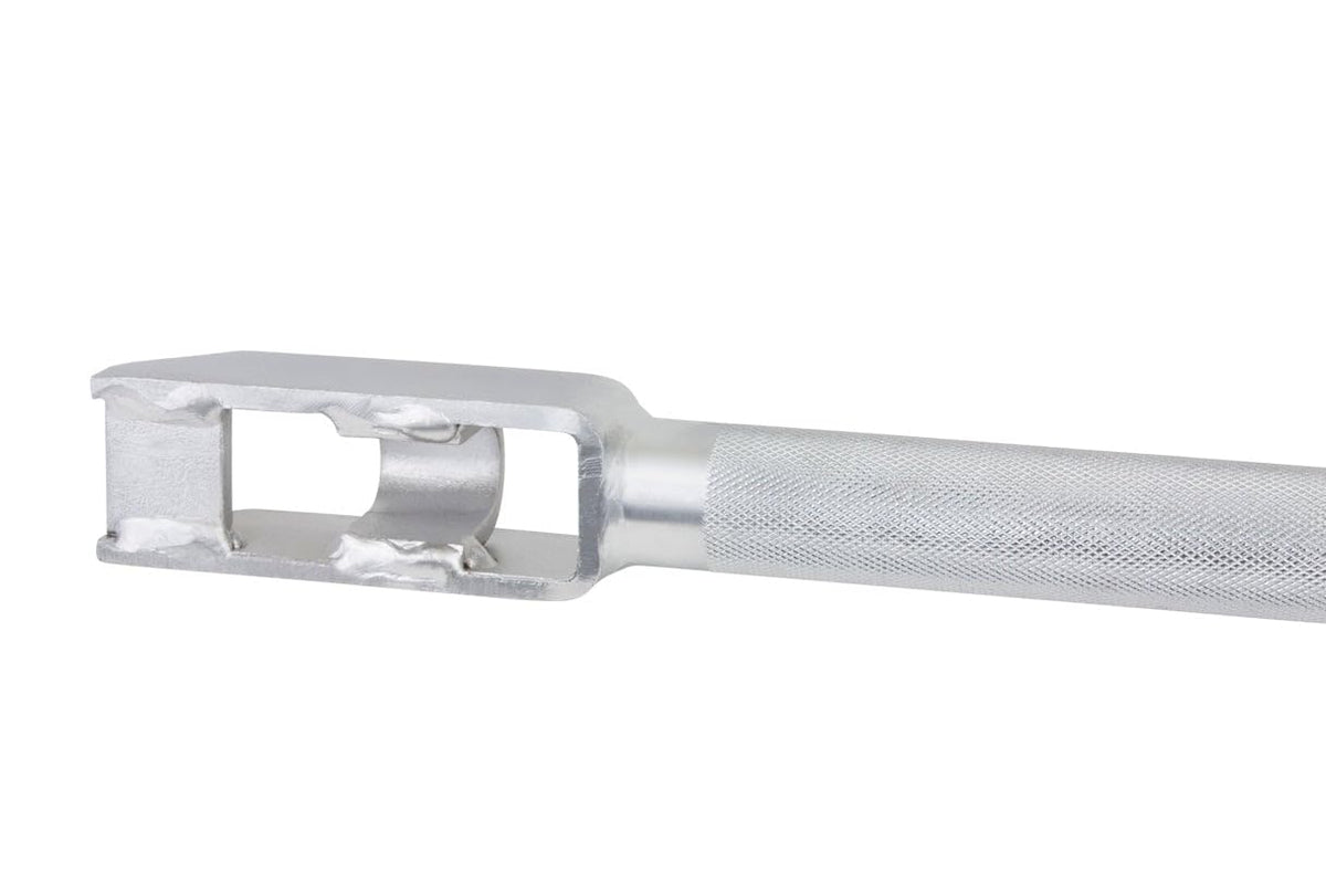 Mytee Products operator using winch bar to tighten cargo showing safer load securing