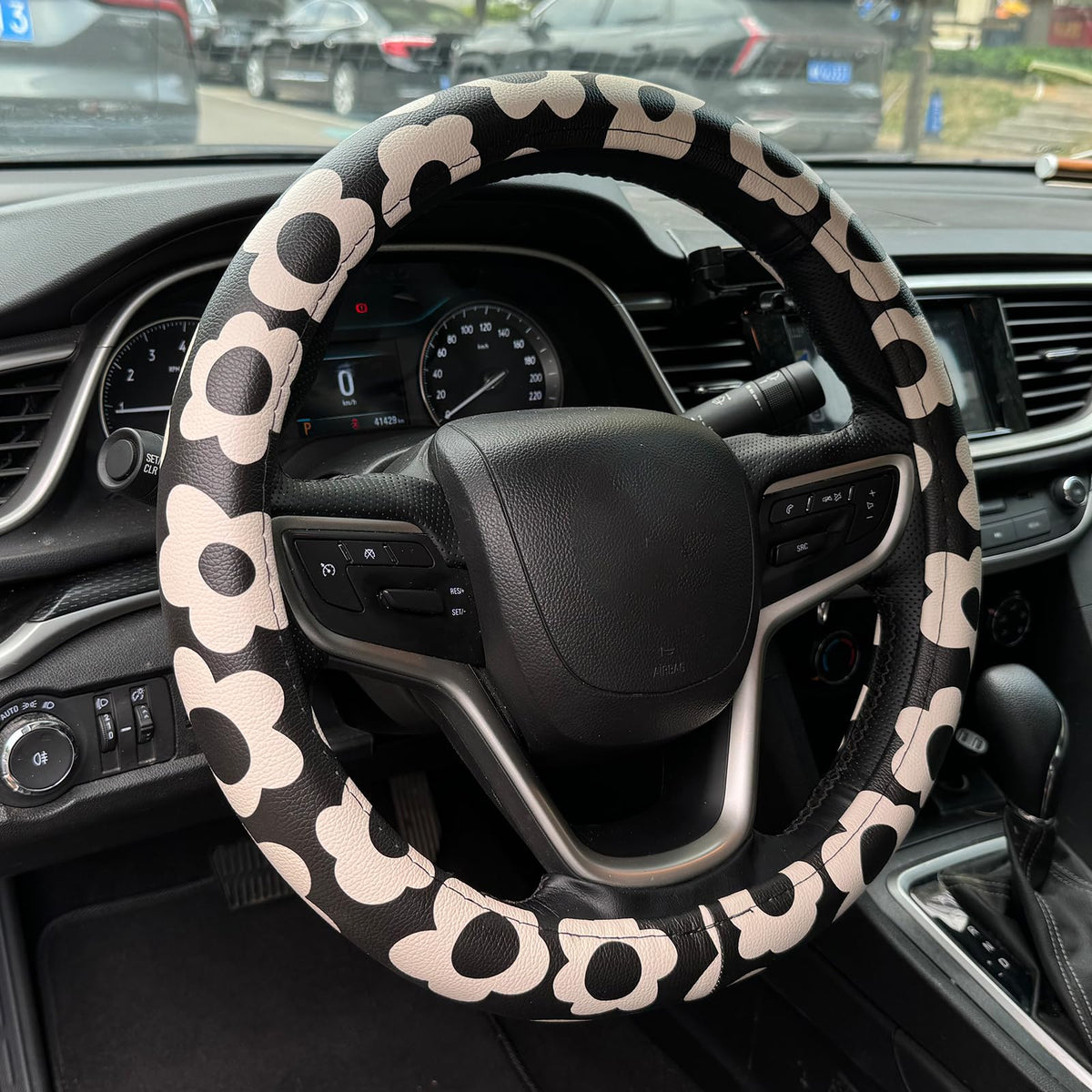 Naxizo front view of floral steering wheel cover shows bold pattern and fit benefit