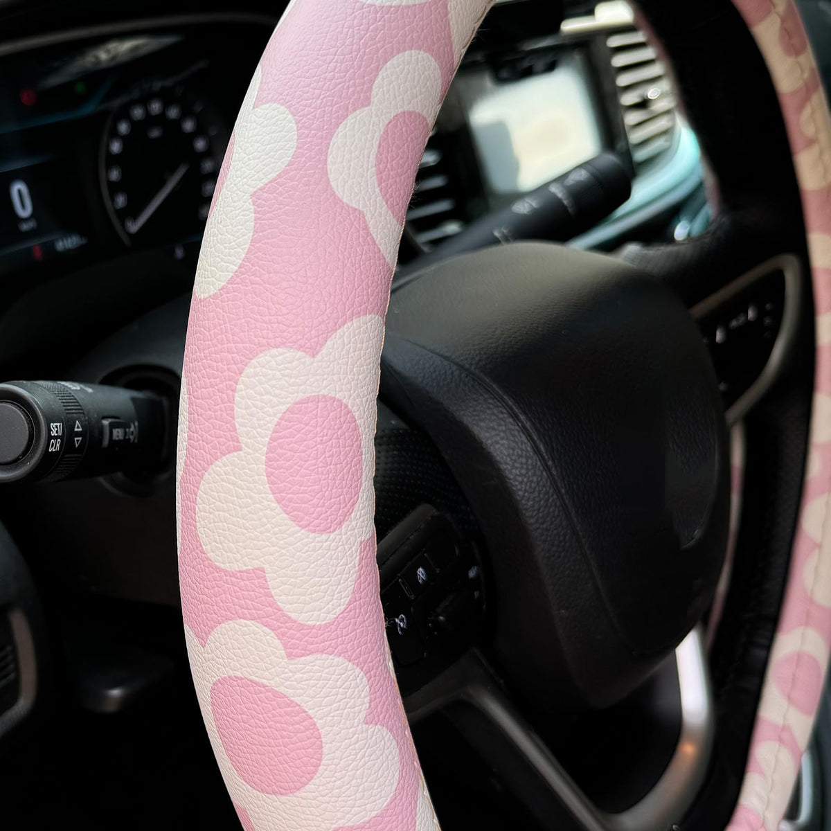 Naxizo side view installed on steering wheel, demonstrates improved grip