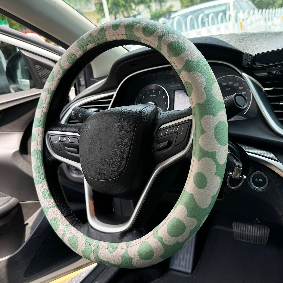 naxizo steering wheel cover front view shows sage green floral print and soft feel