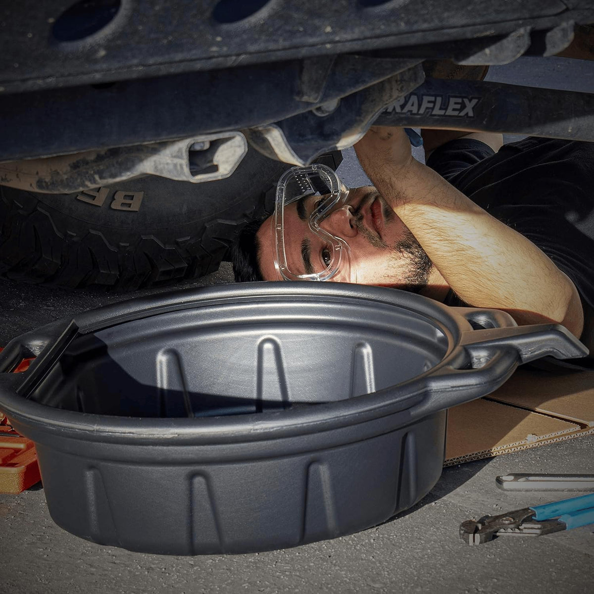NEIKO filled pan pouring into recycling jar for controlled fluid transfer