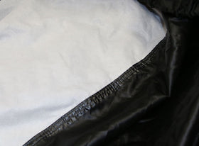 Nelson-Rigg cover side view with panniers showing full luggage fit