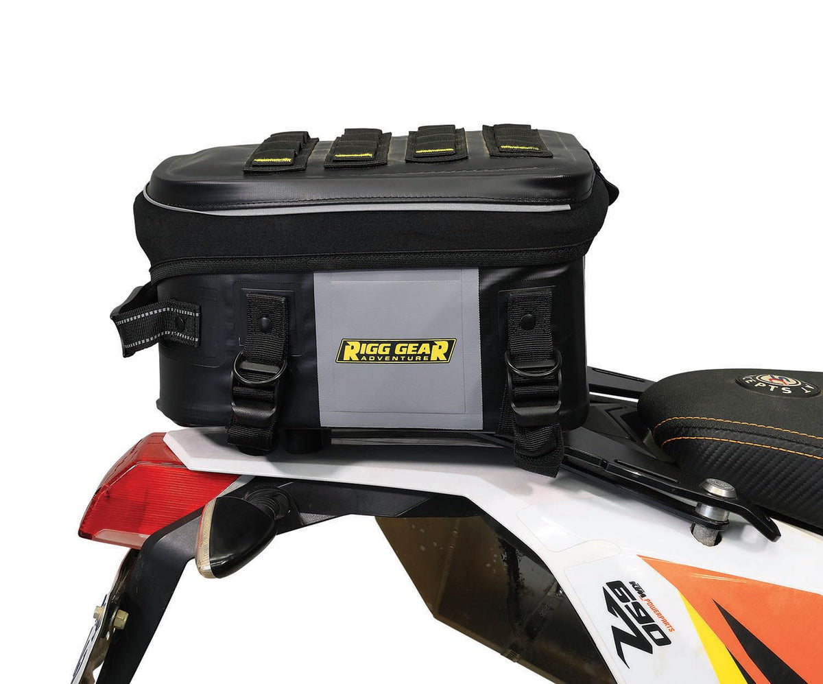 Nelson-Rigg packed on trail demonstrating rugged use and weather protection