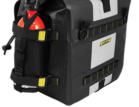 Nelson-Rigg saddlebags mounted on motorcycle illustrating secure RIGG STRAPS attachment