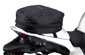 Nelson-Rigg tail bag mounted on a motorcycle in a commuting lifestyle scene