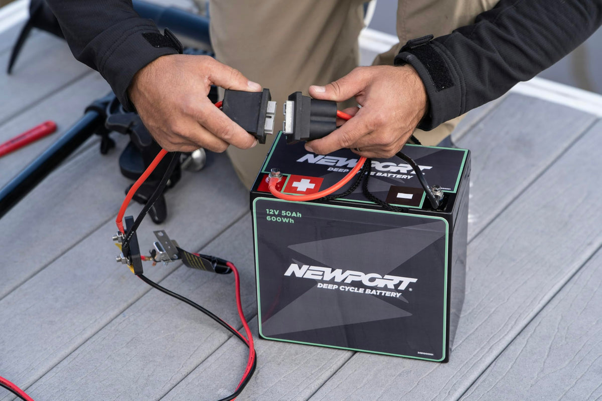 Newport Vessels connector in use on kayak motor showing easy battery swap benefit