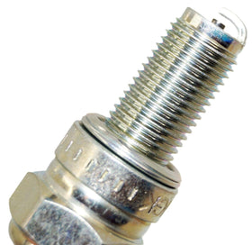 NGK CR8E installed in motorcycle spark plug hole, demonstrating easier starting and fit