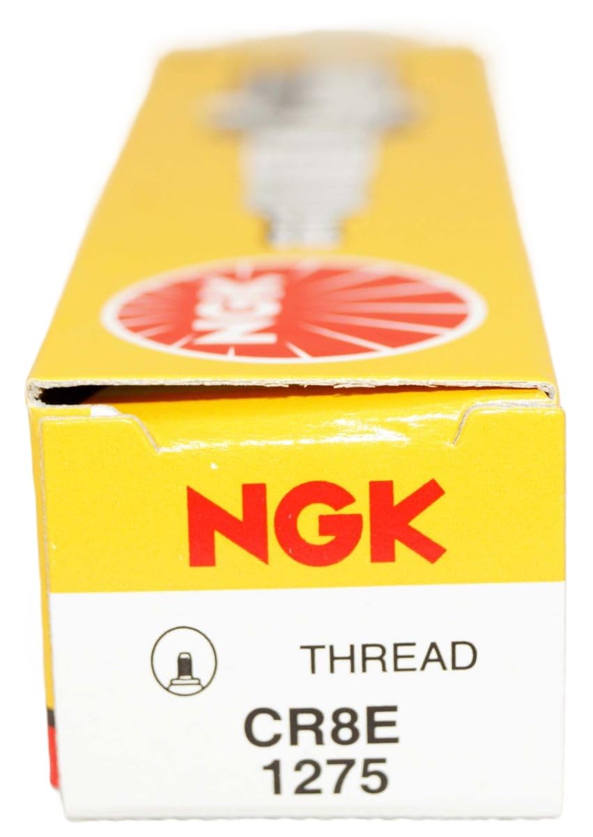 NGK 1275 next to ruler for scale, confirming 19mm reach and accurate size selection