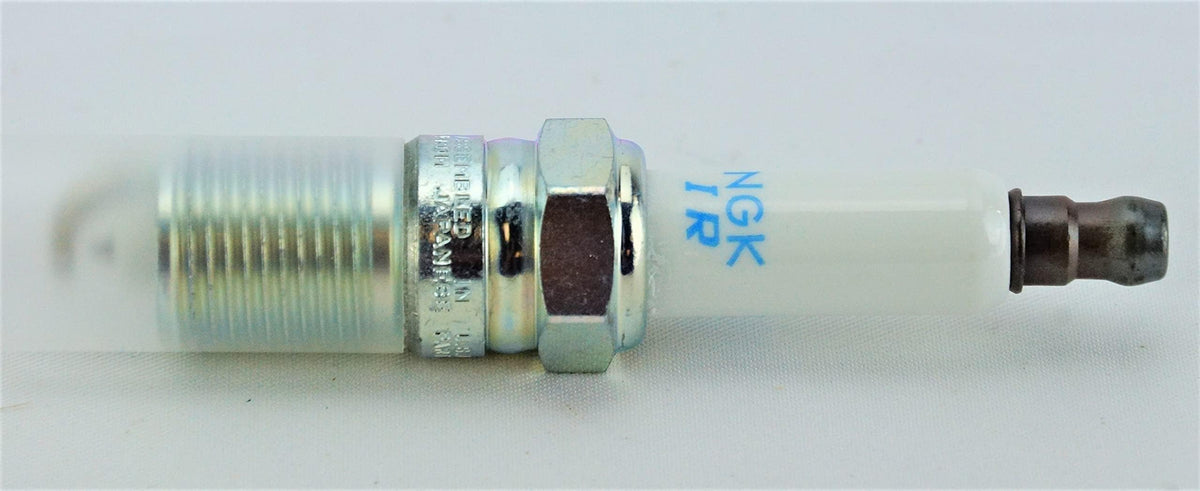 NGK installed in engine cylinder head illustrating proper fit and reliable ignition
