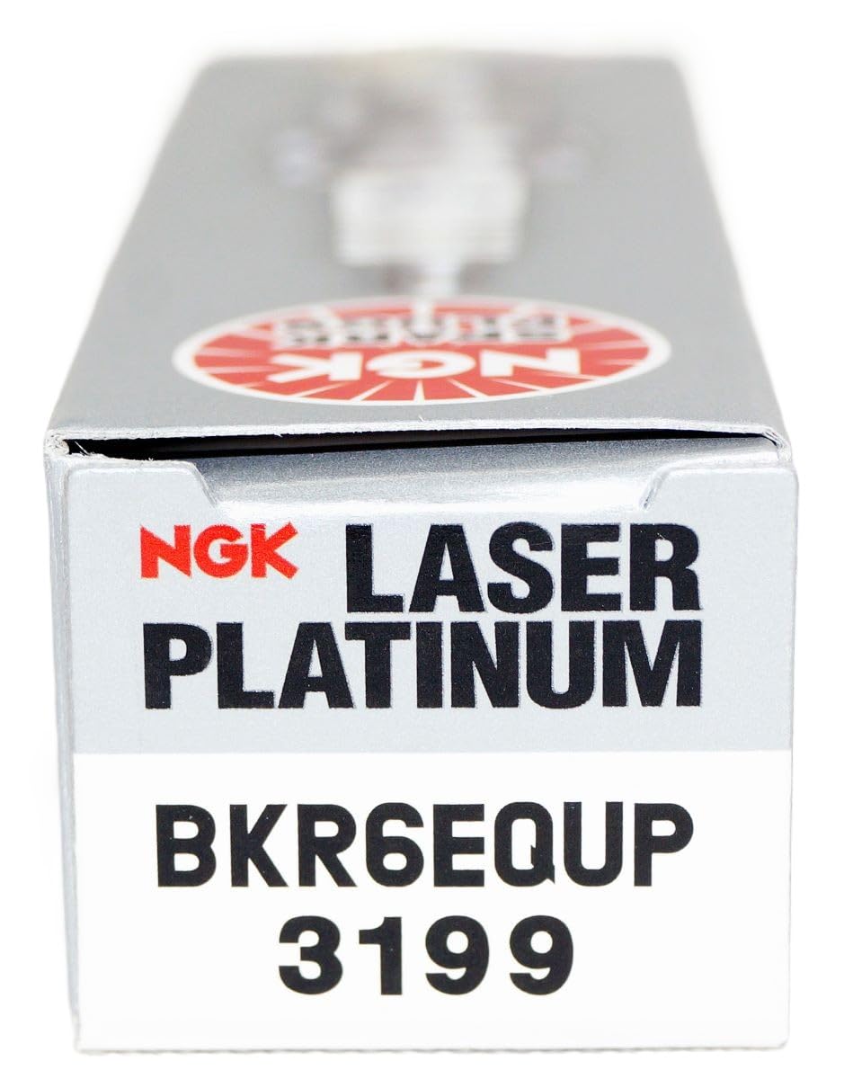 NGK plugs on garage workbench portraying OEM quality and mechanic-ready convenience