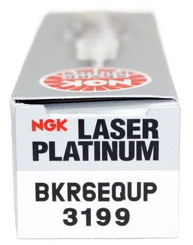 NGK plugs on garage workbench portraying OEM quality and mechanic-ready convenience