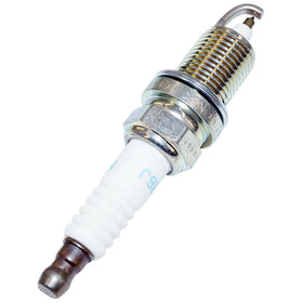 NGK spark plugs on boat deck near engine case illustrating marine use and dependable starts