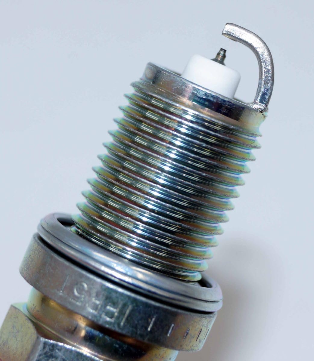 NGK spark plug installed in engine well demonstrating proper fit and performance