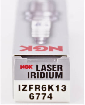 NGK spark plugs in garage setting during installation demonstrating reliability