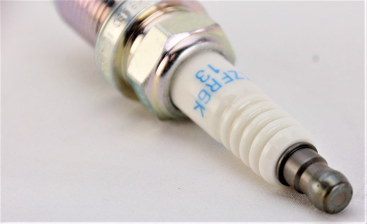 NGK single spark plug close-up highlighting iridium tip for durable ignition