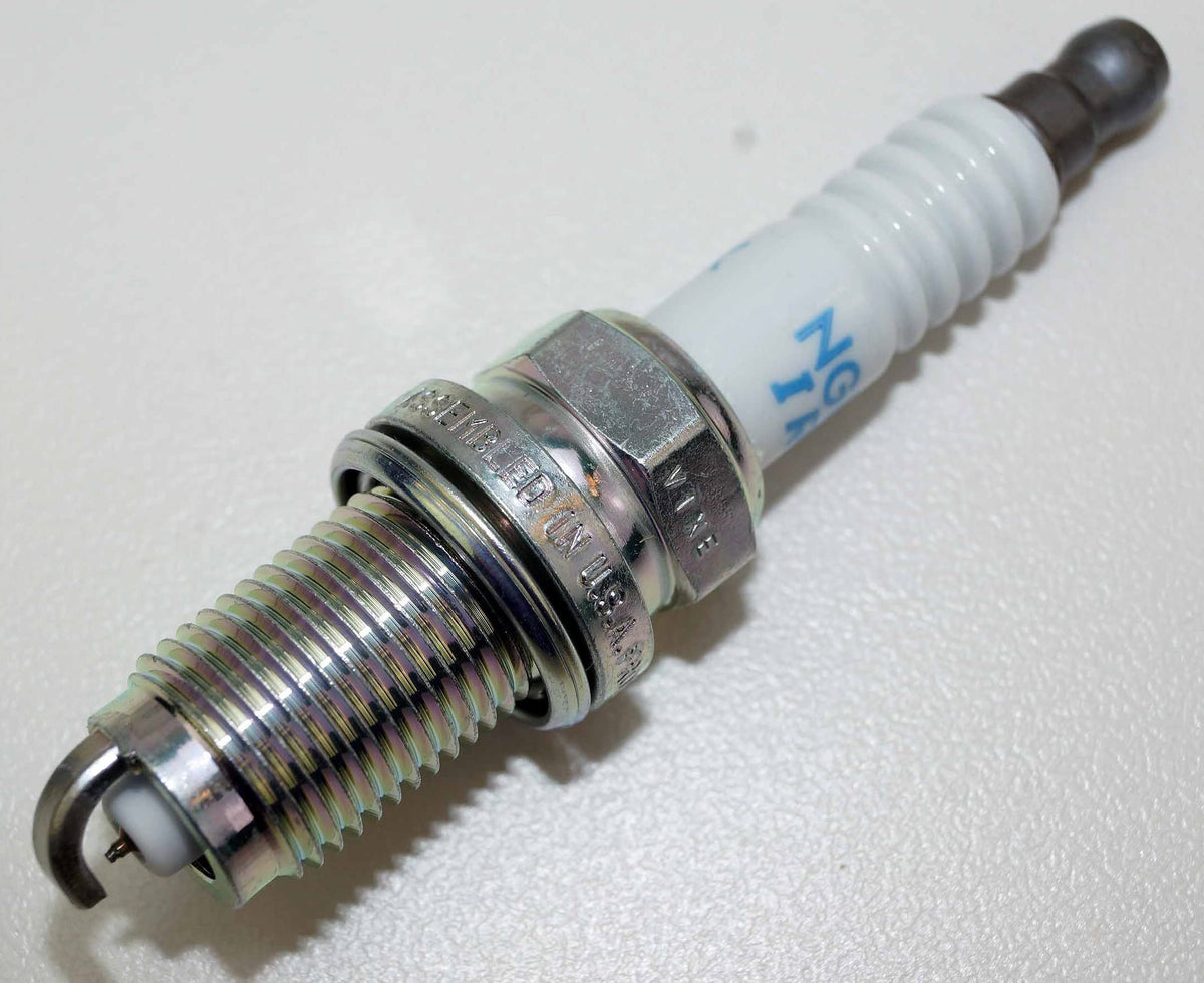 NGK box with included hardware showing organized OEM packaging benefit