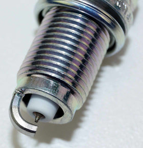 NGK spark plug installed in engine showing proper fit and function
