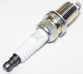 NGK plug next to ruler showing size comparison for fit verification